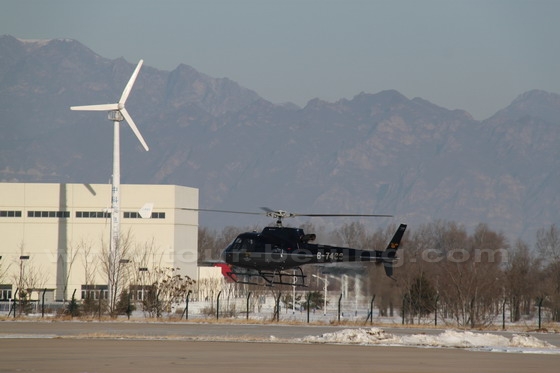The helicopter is taking off the ground