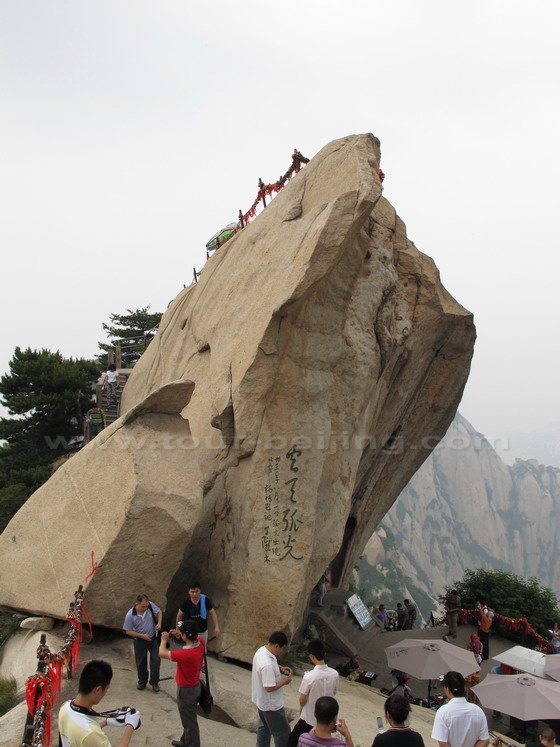 The huge rock is named Lonely Light of Cloud and Rain