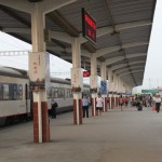 The pillars on the platform are all cirled with commercial signboards.