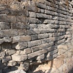 The wall is faced with bricks with dressed slat base.