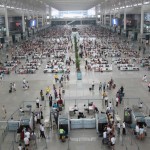 They are passengers waiting for high speed trains in the waiting lounge on the second floor ( F2 ) of the terminal building of Shanghai Hongqiao Railway Station.