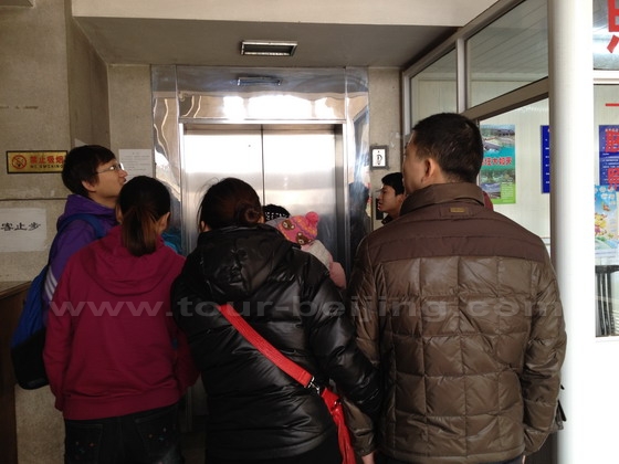 Waiting for a lift up to the 70-meter high bridge tower