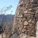 We hike past the yellow tower built of loose slate