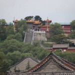 Another temple is nestled on a top cirecled by trees