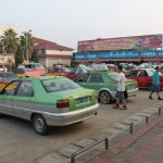many taxis waiting on the square in front of main building of Wuyishan Railway Station