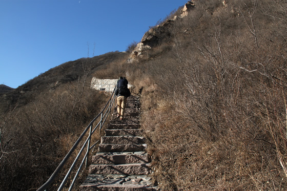 We walk up along the stone paved steps