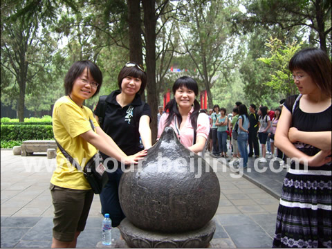 The carved stone of peach shape once was the top of one tower in the temple. It is said that if you touch it, your disease can be dispelled by it