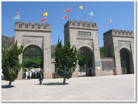 A big entrance gate in the style of Ming Dynasty resembling the Chinese character"ɽ"( meaning "Hill")