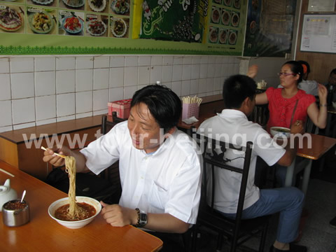 I enjoy the Shanxi noodle at a small noodle restaurant on the west of the square in front 