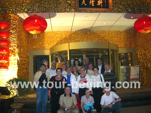 Taking a picture in front of the restautant after the dinner