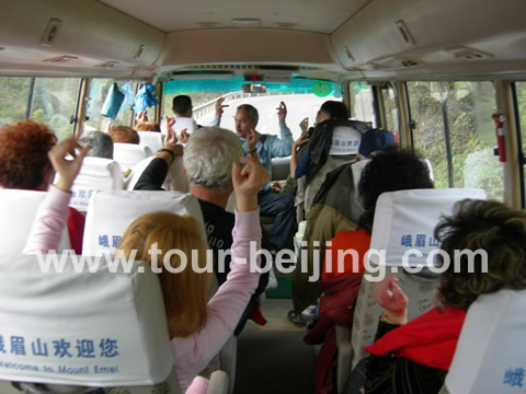 George from the group sat at the front entertaining the people on the bus