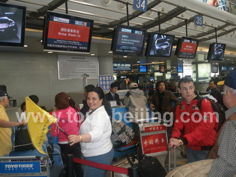 Line up for check-in at the counter.