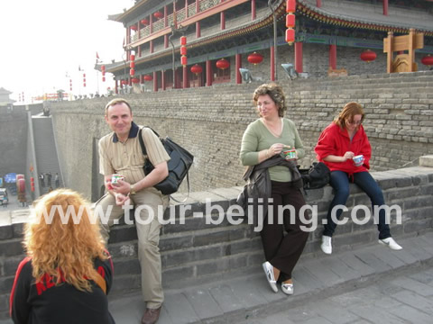 People enjoying ice-cream on the wall