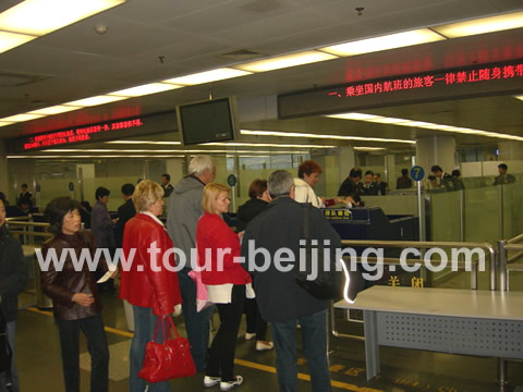 People were waiting for the security check at the airport