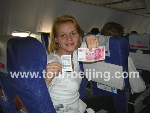 Ms Tisca was the luckiest person on the plane since she got RMB 100 for the lottery held on this flight.