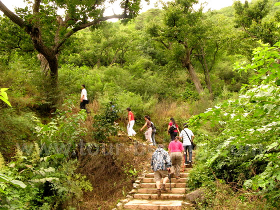 Enjoy walking along the reservoir with the Great Wall hanging overhead